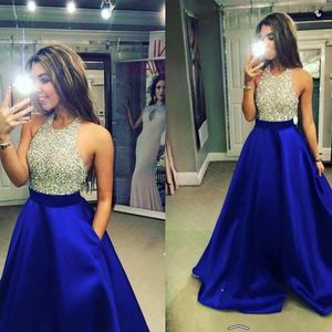 New Royal Blue Satin Prom Dresses Halter Beaded Top A Line Floor Length Party Dresses Evening Gowns Jewel Sequins Backless Homecoming Dress