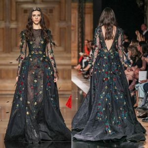 Runway Fashion Black See Through Evening Gowns With Hand Made Flowers Sheer Long Sleeve Open Back Prom Dresses Floor Length Formal Wear