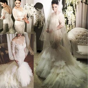 Abiti da sposa a maniche lunghe con scollo a illusione 2017 Appliques di perline Abito da sposa a sirena a sirena a strati Abito da cappella affascinante Vestido De Novi