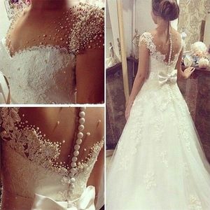 Koronkowa sukienka ślubna vestidos de novia z łukiem krótkie rękaw ukochane perełki perły Sheer Buttons