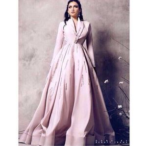 Pink Evening Wear Sukienki 2019 Skromna linia Sukienka z długim rękawem V Neck Neck Sparkly Koralik Dubaj Arabski Suknie Yoysef Aljasmi