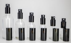 Parti i klarglassprayflaskor 10 ml 15 ml 20 ml 30 ml 50 ml 100 ml Bärbara påfyllningsbara flaskor med parfymatomizer svart lock