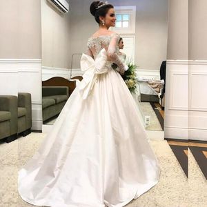 Arabic Long Sleeve Wedding Dresses Sheer Neck Off the Shoulder Beaded Lace Appliques Illusion Back Taffeta Bridal Gowns with Oversize Bow
