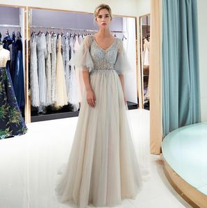 Amazing Silver Beaded Prom Dresses Sexy V Neck See Through Beige Tulle Evening Gowns Sweep Train Women Formal Party Dress Custom Made