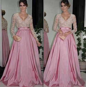 Sexy See Through Pink Evening Dresses Top Major Beaded Illusion Long Sleeves Deep V Neck Formal Party Gowns Floor Length A-Line Prom Dresses