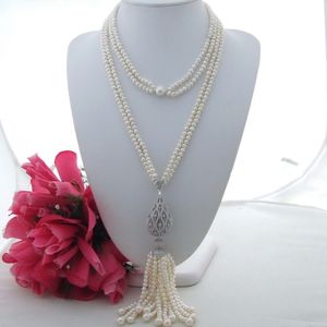 Incantevole collana con pendente in nappa di perle d'acqua dolce bianche a 2 file da 6-7 mm con micro intarsio in zirconi lunga 104 cm