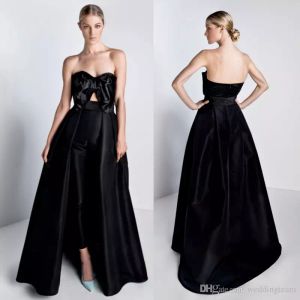 Eleganta svarta jumpsuits prom klänningar med avtagbar tåg båge strapless nacke formella kvällsklänningar satin overkirt prom klänning anpassad