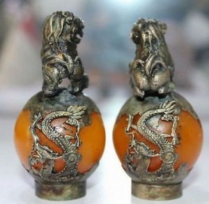 Tibet-Silber, handgeschnitztes Bernstein-Drachen-Phoenix-Kugel-Löwen-Statuenpaar