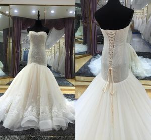 Luxury Mermaid Bröllopsklänningar Ruffle Bling Beading Crystal Sequins Stropless Open Back Lace-up Bridal Gowns Chapel Train Bröllopsklänning Plus