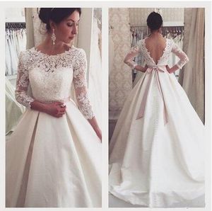 2019 Illusion Manica lunga A-line Abiti da sposa Bateau Scollo a barchetta Crystal Sash Ribbon Drappeggiato Vita impero Abito in pizzo Abiti da sposa Plus