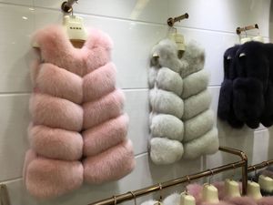 Große Förderung Luxus ärmellose Westen Jacke Frauen Puffy Pelz Weste warme Winter Faux Fuchs Weste plus Größe