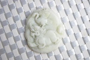 Beautiful natural (shaanxi blue field) white and yellow jade, hand-carved delicate elliptic crane opera unicorn. Talisman necklace pendant.