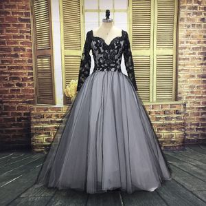 Kraj Czarne Gotyckie Suknie Ślubne Unikalny dekolt Backless Lace Aplikacje Sheer Z Długim Rękawem Tulle Suknie Ślubne Otwórz Wróć pociąg