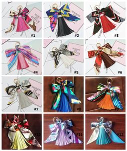 12 Kolory Kreatywny Bowknot Kwiat Tassel Keychain Car Key Breloczkowy Torba Wisiorek Dostępny Materiał Superman Brelok Backpack Akcesoria MK667