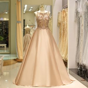 Champagne Evening Dresses 53718 Juvel ärmlös pärlstav prom tillbaka dragkedja svep tåg naturligt siden satin storlek US2-16 festklänningar