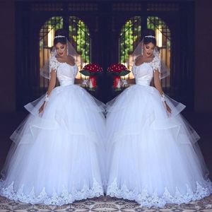 2018 Ball Gown Wedding Dresses Puffy Illusion Long Sleeves Lace Appliques Beaded Tiered Ruffles Tulle Arabic Plus Size Formal Bridal Gowns