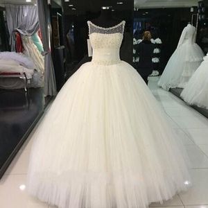 Exquisite Pearls Crystals Embellished Ball Gown Wedding Dresses Sheer Neck Sleeveless Ruched Waist Puffy Tulle Bridal Gowns Floor Length