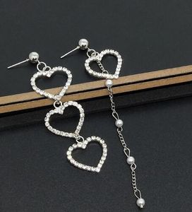 new hot The new jewelry is set with diamond heart ear studs asymmetrical long pearl female earrings earrings earrings classic chic exquisite