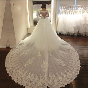 2024 Luxury Lace Wedding Dresses With Long Train Ny ankomst Långärmad älskling Beaded Applicques Bridal Dress Gown Robe de Mariage