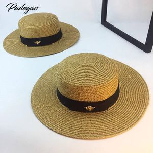 Primavera e nuovo retro oro intrecciato a testa piatta paglia Lady Wide Eaves protezione solare sole cappello estivo berretto C19041701
