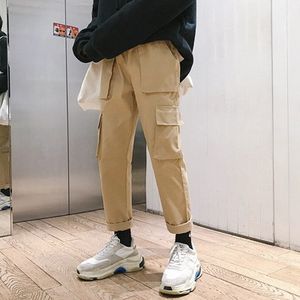 ファッションの男性のスウェットパンツ春の新しい男性プラスの緩い香港スタイルのブランドの貨物パンツのソリッドカラーのマルチポケットストレートパンツ