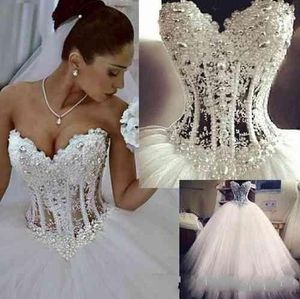 2024 Cheap Hot Bling Ball Gown Wedding Dresses Sweetheart Lace Appliques Beads Pearls Tulle Sweep Train Plus Size Formal Bridal Gowns 403