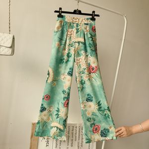 Yeni tasarım Kadınların Elastik Bel Yüksek Bel Gevşek Baskı Çiçekleri Tavuskuşu Yeşil Renk Bohemya Tarzı Gündelik Geniş Bacak Uzun Pantolon Pantolon