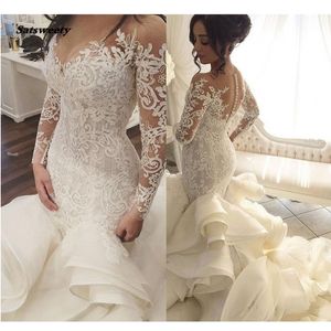 Abiti da sposa in pizzo arabo saudita Abiti da sposa a sirena con maniche lunghe Dubai Royal Train con bottoni e volant Robe De Mariee