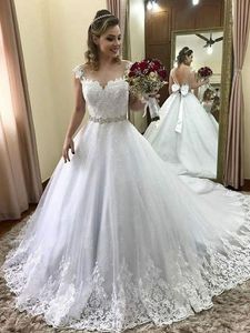 Sparkly Tulle Lace Wedding Dress Cap Sleeve Sheer Neckline V Open Back Bow Applique Beaded Crystal Bridal Gowns Plus Size 2019 Wedding Gown