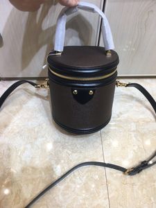 Designer-Women's new round bucket shoulder bag. Designer cosmetic bag. Fashion lady style. Detachable leather shoulder strap.