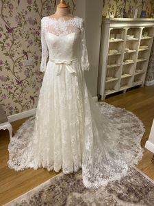 Vollständig aus Spitze gefertigte Brautkleider 2020, Ballkleid, 3/4-Ärmel, romantische Robe de Mariage, hausbedeckte Knöpfe auf der Rückseite, Kapellenschleppe