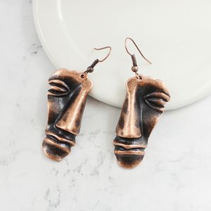 Tredimensionell trasig halvt ansikte hängsmycke örhänge personlighet kreativ brons retro etniska örhängen fest klä upp tillbehör