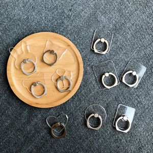 Clear Finger Ring Grips Holder och fästen för mobila mobiltelefoner Tabletter Transparent 360 graders rotation 180 graders Flip Buckles Stativparentes Kickstands Stents