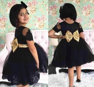 Korte zwarte meisjes feestjurk gouden boog riem korte mouw een lijn mooie nieuwe ontwerp meisjes pageant jurken custom size