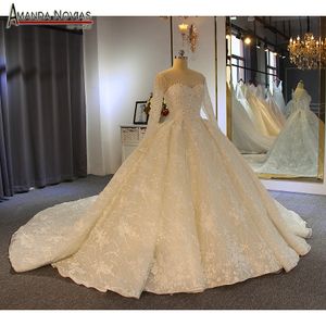 Luxury Crystal Ball Gown Wedding Dresses Lace Appliqued Sequins Beaded Sweep Train Robes De Mariée Long Sleeve Weeding Gowns Bridal Dress
