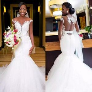 2019 Fit and Flare African Mermaid Wedding Dresses Sheer Neck Cut Out Open Back Lace Appliques Tulle Skirt Capped Shoulder Bridal Gowns