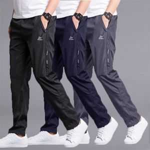Primavera verão sportwear calças homens poliéster calças de secagem rápida desgaste desgaste ultra-luz reta calça solta calça