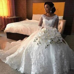 Abiti da sposa africani di lusso girocollo trasparente maniche lunghe scoop applicazioni di pizzo abiti da sposa arabi in rilievo 2019 nuova moda su misura