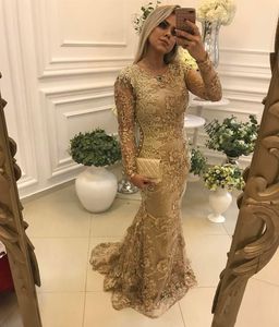 2019 New Arrival Luxury Gold Mermaid Evening Dresses Jewel Neck Lace Appliques Beaded Pearls Long Sleeves Sweep Train Plus Size Prom Gowns