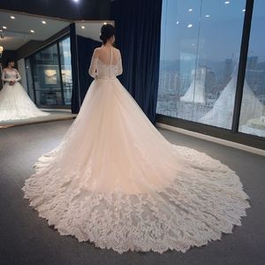 Court Train Lace Wedding Dresses Long Bridal Gowns Sheer Neckline Soft Tulle with Lace Pleats Sheer with lace Long Sleeves buttons Back