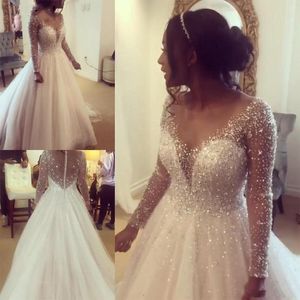 Bling bling illusion långa ärmar prinsessan bröllopsklänning 2020 Sheer halsringning juvelkristallpärlor a-line imperium midja afrikansk weddi254t