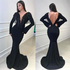 Abiti da ballo neri con nappe Abiti da sera sexy a sirena con scollo a V profondo senza schienale Abiti da sera lunghi fino al pavimento 2019 Abiti da cocktail party di moda