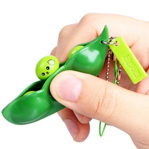 Original Ny Sojabönns nyckelkedja för män Rolig Extrusion Pea Bean Keychain Kvinnor Bag Telefon Charms Trinket Stress Losse Toys Present