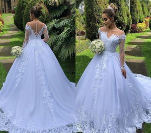 2020 New Hot Sexy Arabic Long Sleeves A Line Wedding Dresses Illusion Lace Appliques Beaded Plus Size Court Train Sheer Back Bridal Gowns