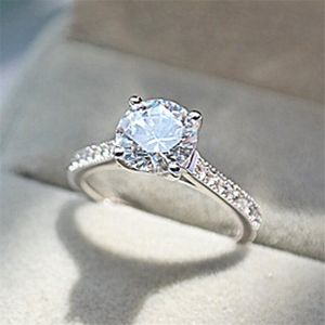 シンプルなファッションユニークなジュエリーレアル925スターリングシルバーラウンドカットホワイトトパーズCZダイヤモンド宝石の女性の恋人の贈り物のためのウェディングブライダルリング
