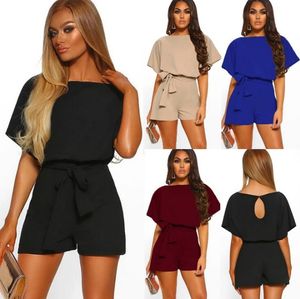 Kombinezony damskie pajacyki luźne casualowe w stylu streetwear letnie kombinezony dla kobiet bandaż z paskiem Playsuit z krótkim rękawem solidna tunika z kieszenią