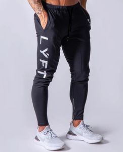 Nowe jogging sportowe dresowe presje gimnastyczne men men joggers bawełniane ścieżki szczupłe spodnie kulturystyka