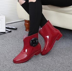 Varm försäljning-ny ankomst regn stövlar vattentät platt med skor kvinna regnskor vatten gummi ankel stövlar bowtie