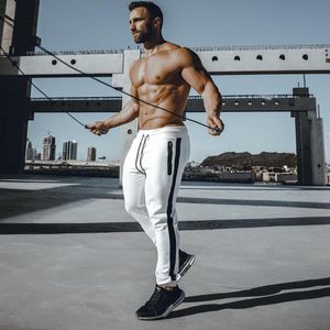 Running TrackPants Mens Skinny Joggers Sweatpants Bodybuilding Sport Bomull Byxor Gym Sportkläder Man Fitness Träning Byxor