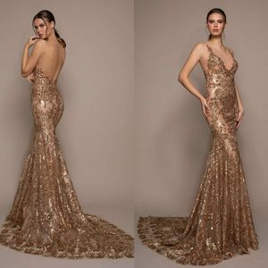 Splendidi abiti da sera a sirena in oro con applicazioni di pizzo con scollo a V senza maniche Robe De Soiree Abiti da ballo sexy senza schienale con paillettes